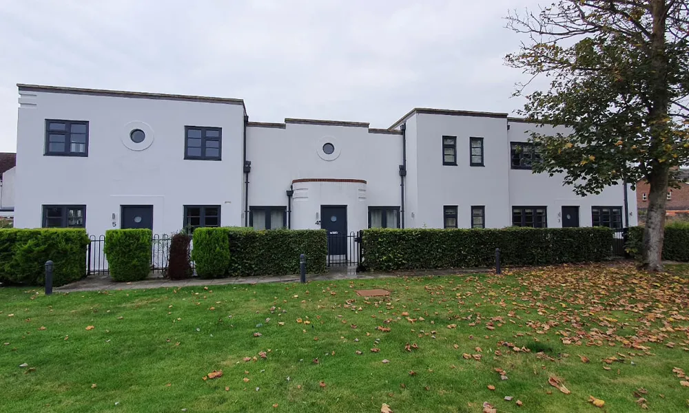 a large white building with a black door