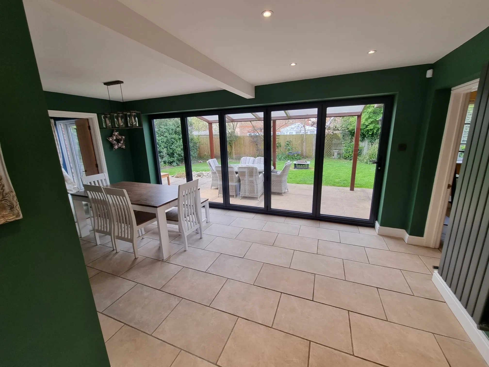 a dining room with a large sliding glass door